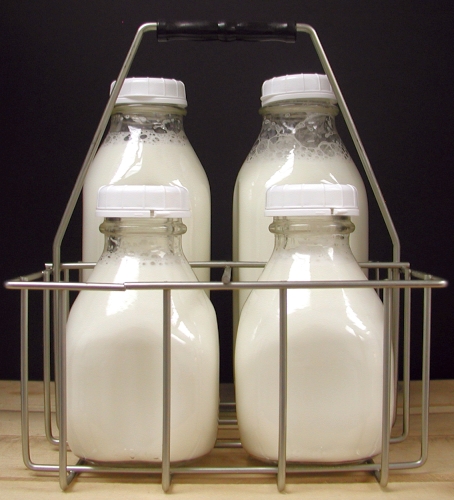 6 Glass Milk Bottles in Metal Carrier
