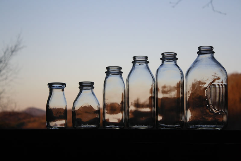 https://www.bucket-outlet.com/pics/Glass-Milk-Bottles-Sunset-Large.jpg