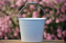 white metal pail with handle